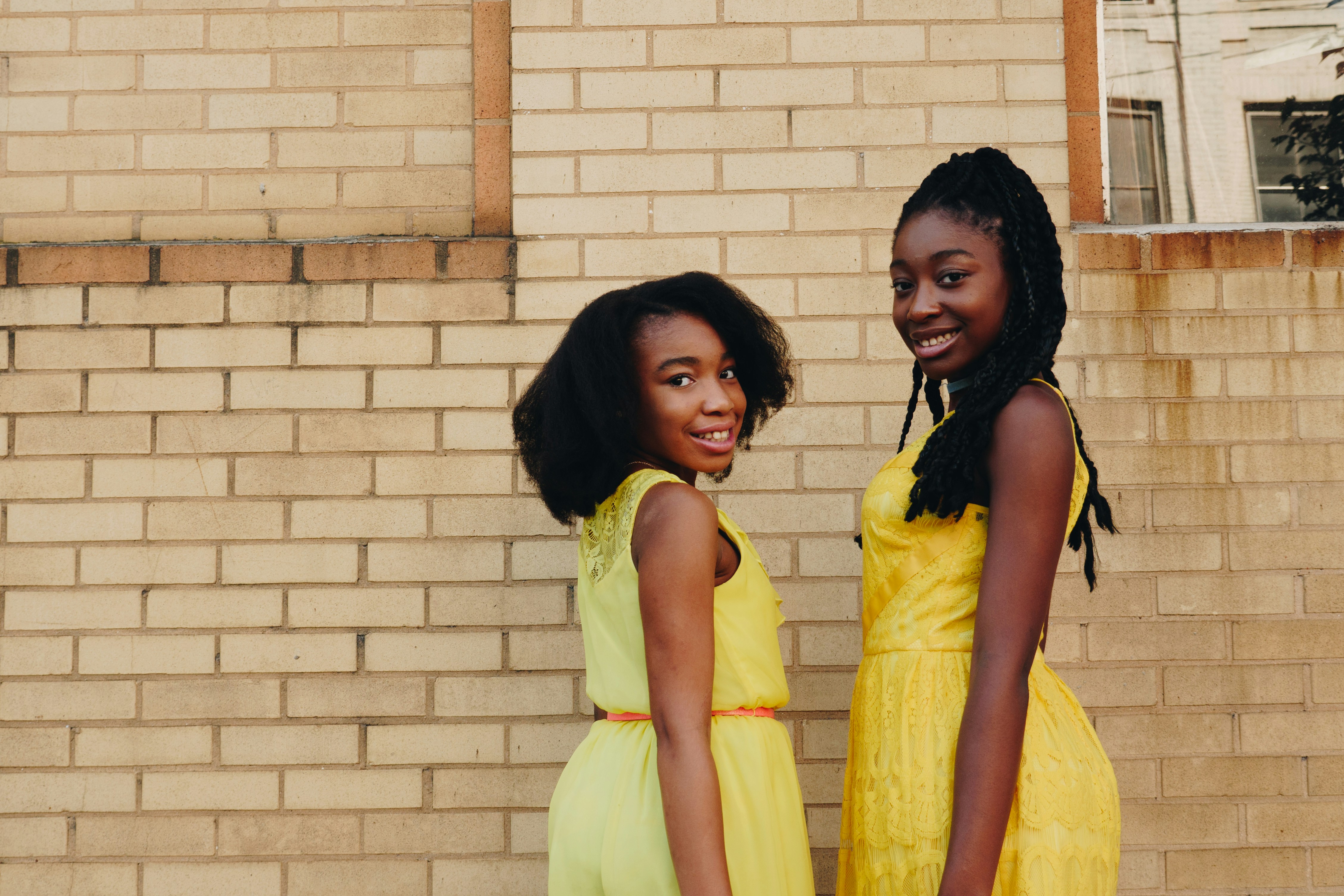 Smiling girls in yellow