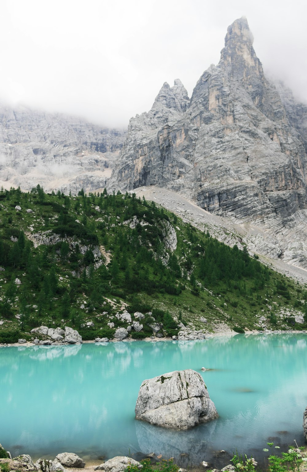 gray mountain near water