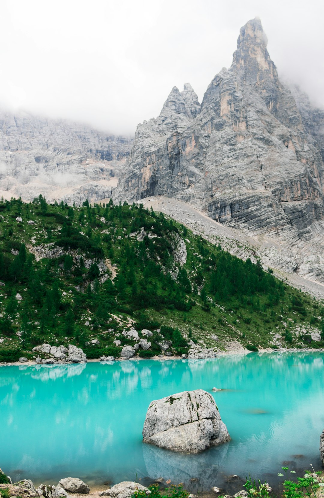 gray mountain near water