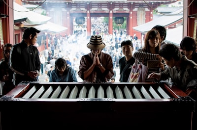 Volunteers offering annadaan with care and devotion in the temple courtyard.
