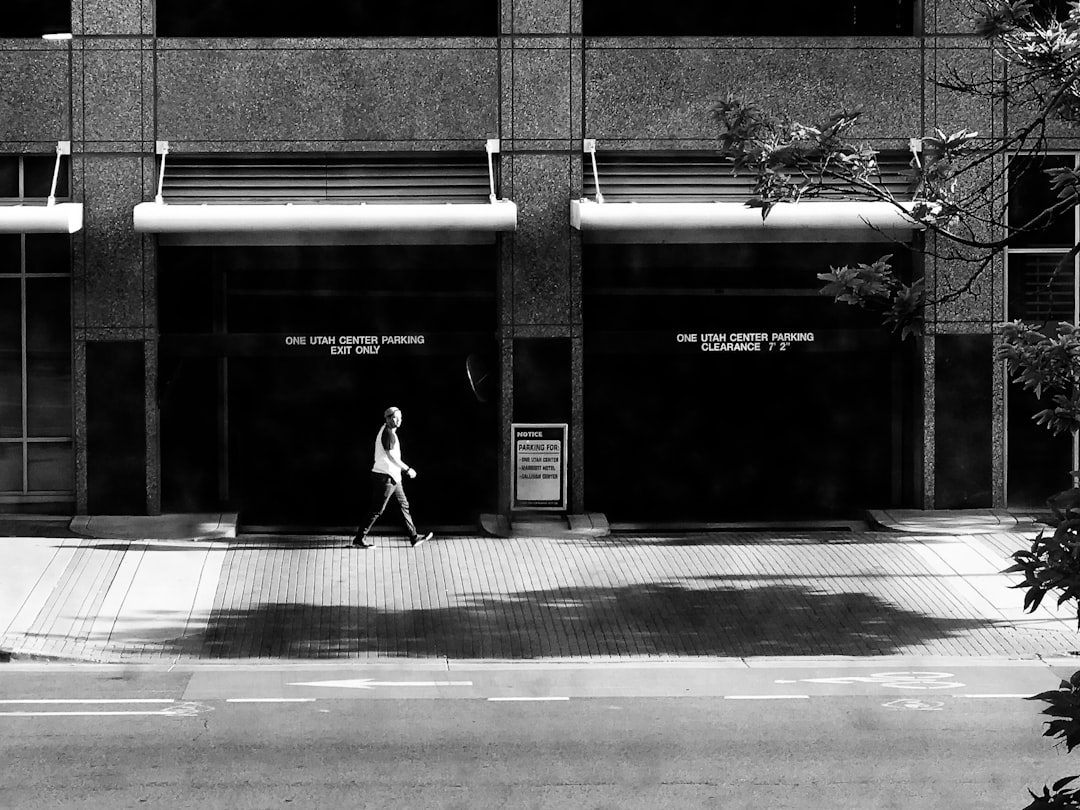 person walking in front of building
