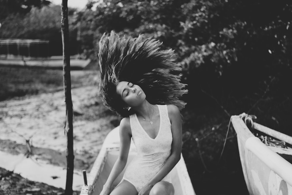 grayscale photo of woman wearing sleeveless dress