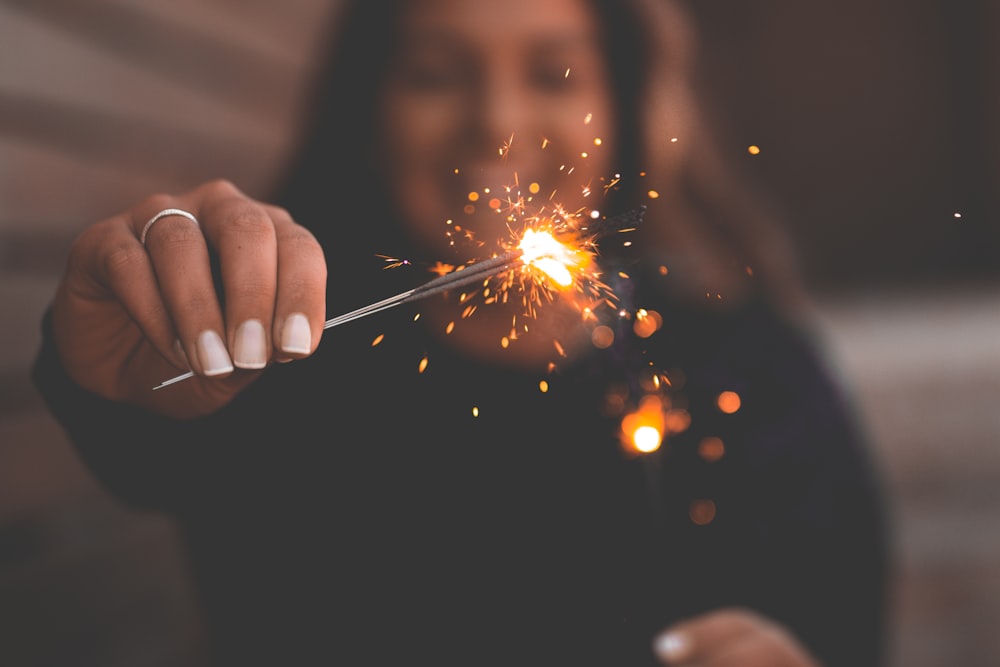 person holding firecracker