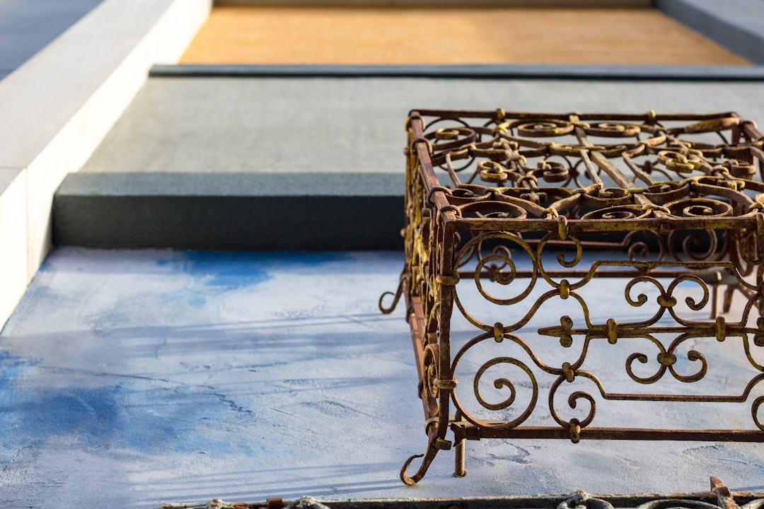 brown metal crate on blue surface