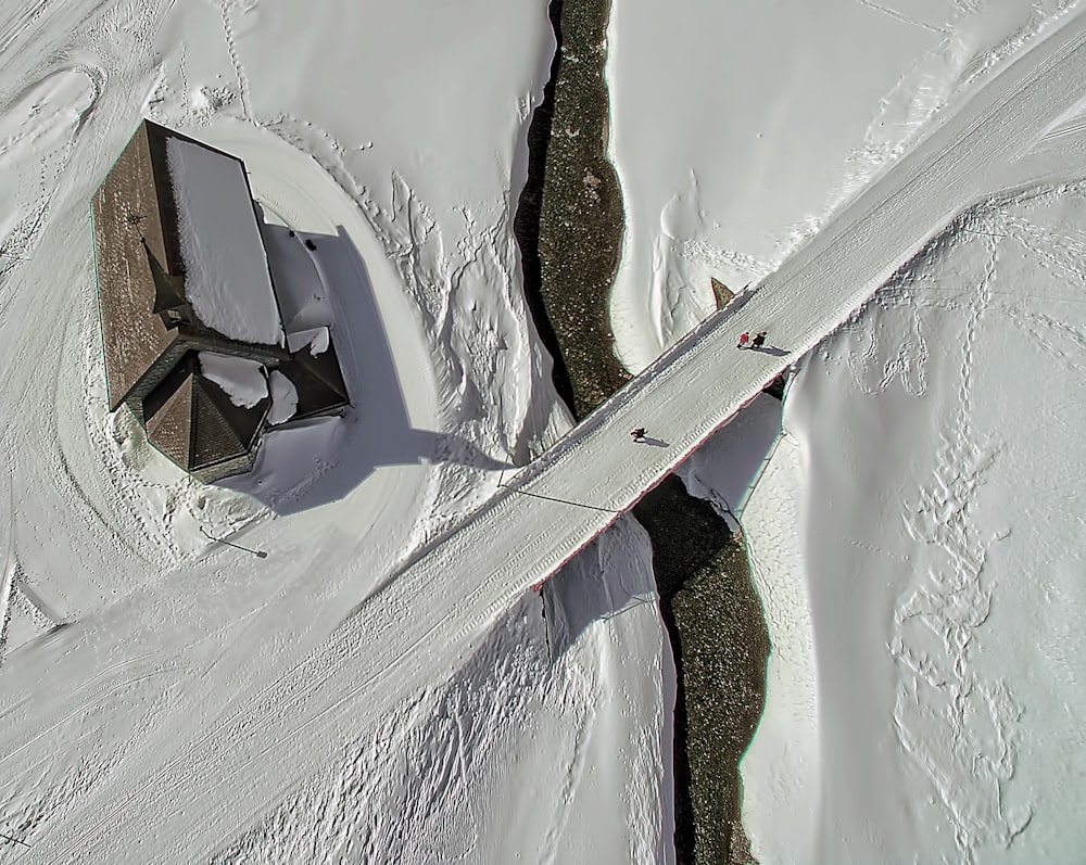 snow-covered flooring near house at daytime