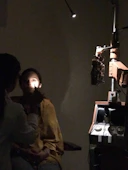 Modern ophthalmologist examining a patient’s eye with advanced diagnostic equipment in a sleek clinic.