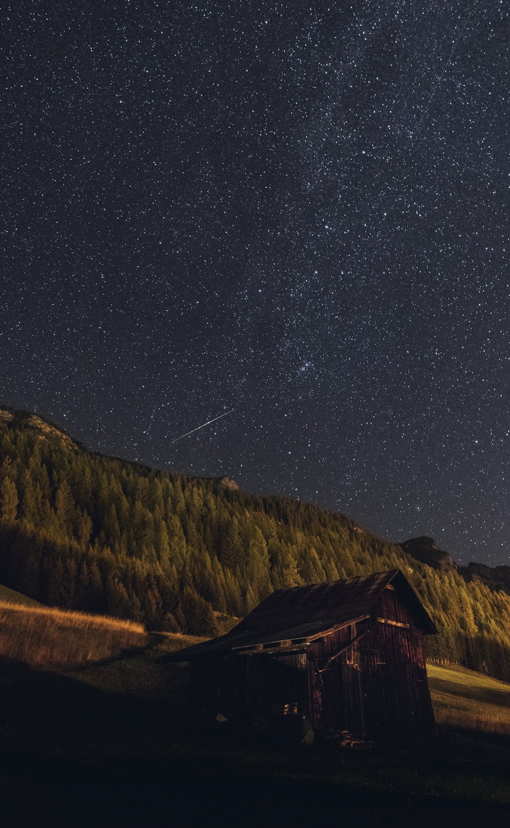 brown house beside mountain