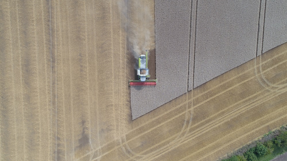 A drone shot of a combine harvester in a field in Barton