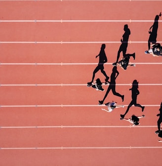 group of people running on stadium