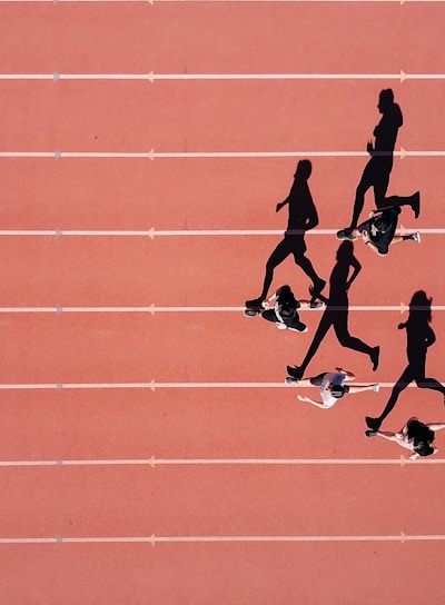 group of people running on stadium