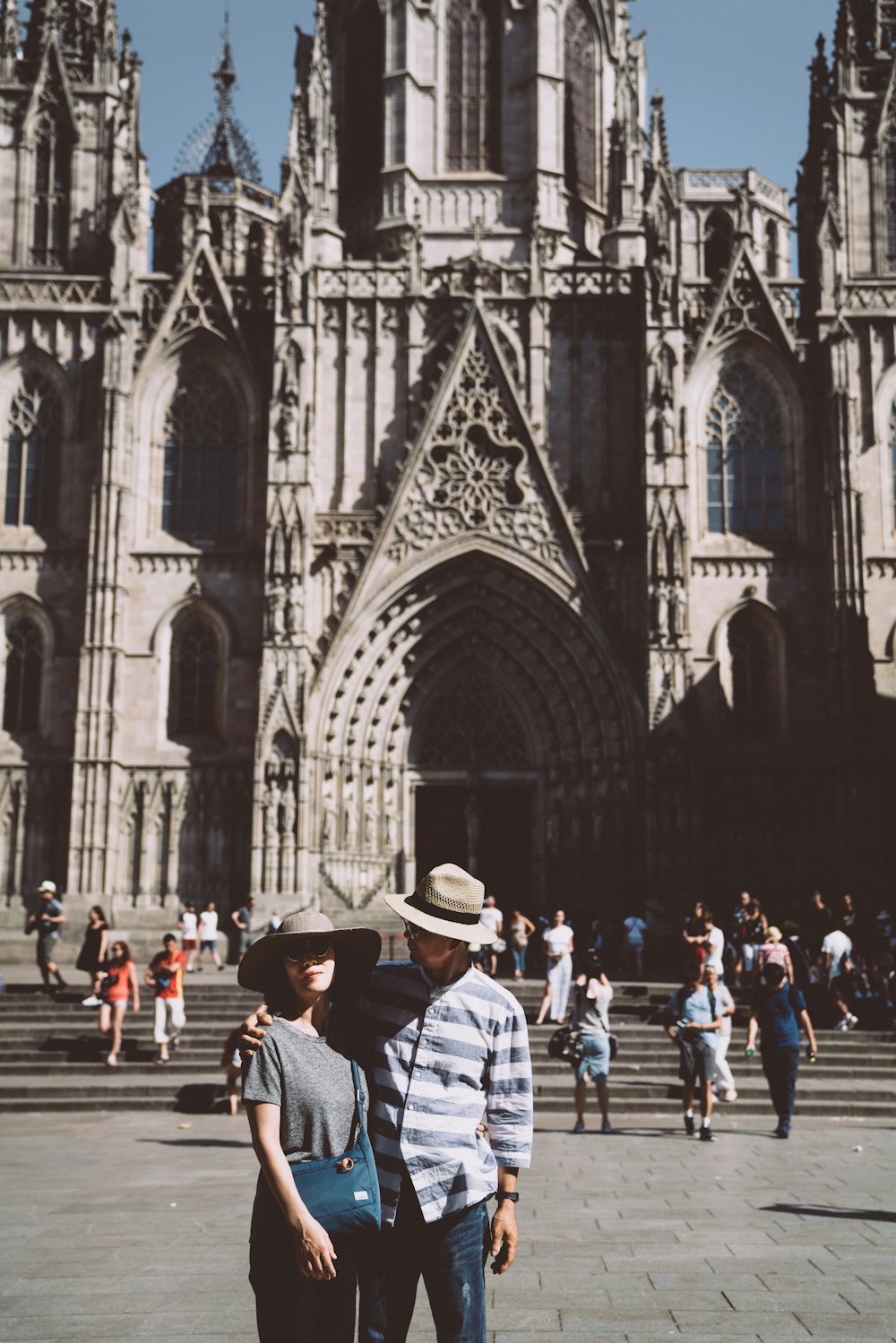 man and woman standing near church