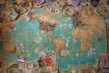 A world map highlighting countries with their respective currencies.