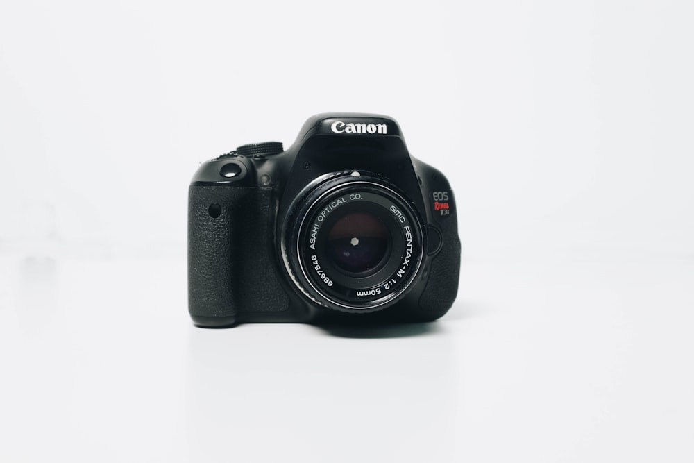 black Canon EOS Rebel-series DSLR camera