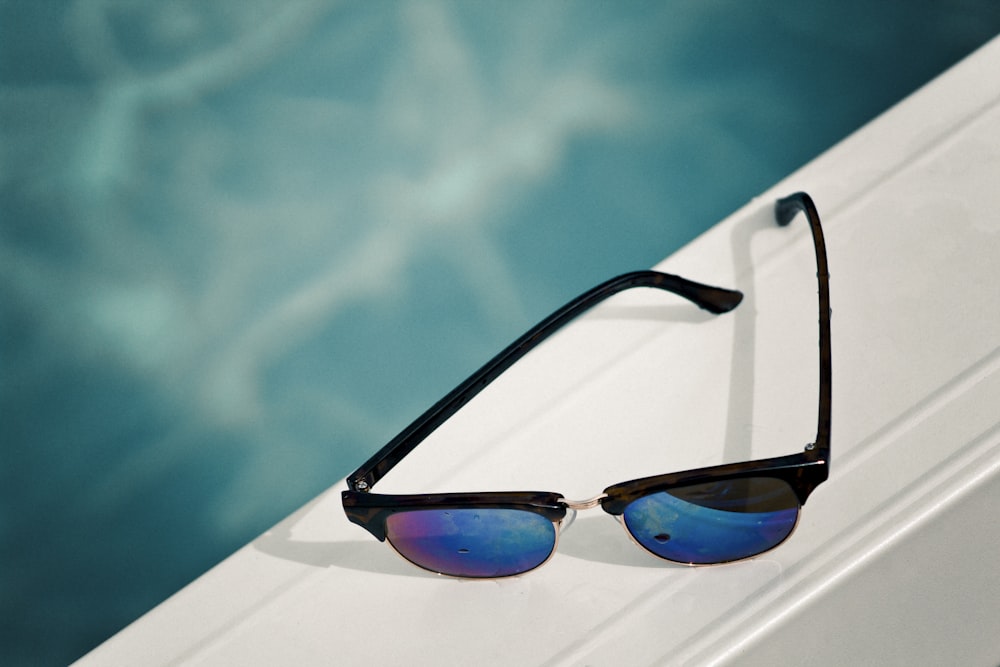 clubmaster sunglasses on white surface