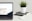 MacBook Pro near green potted plant on table