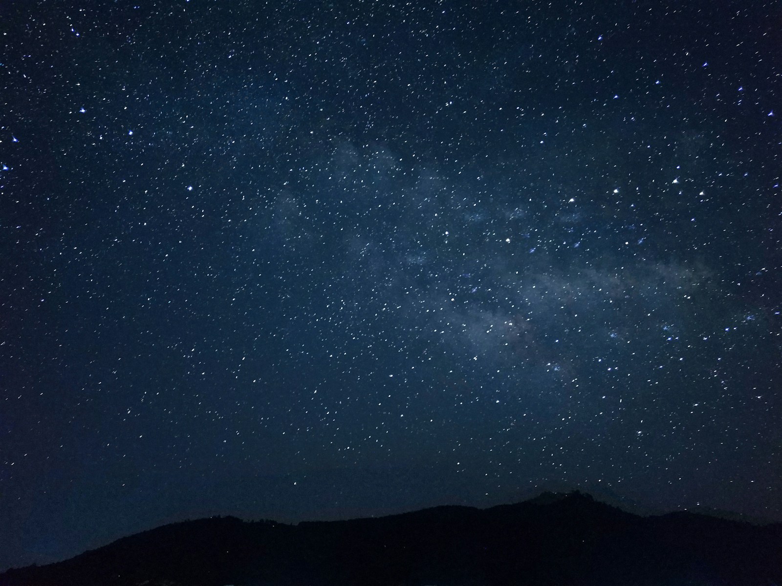 The night sky filled with stars above a mountain silhouette, evoking Astro's celestial namesake and the framework's ambition to power the web's content layer.