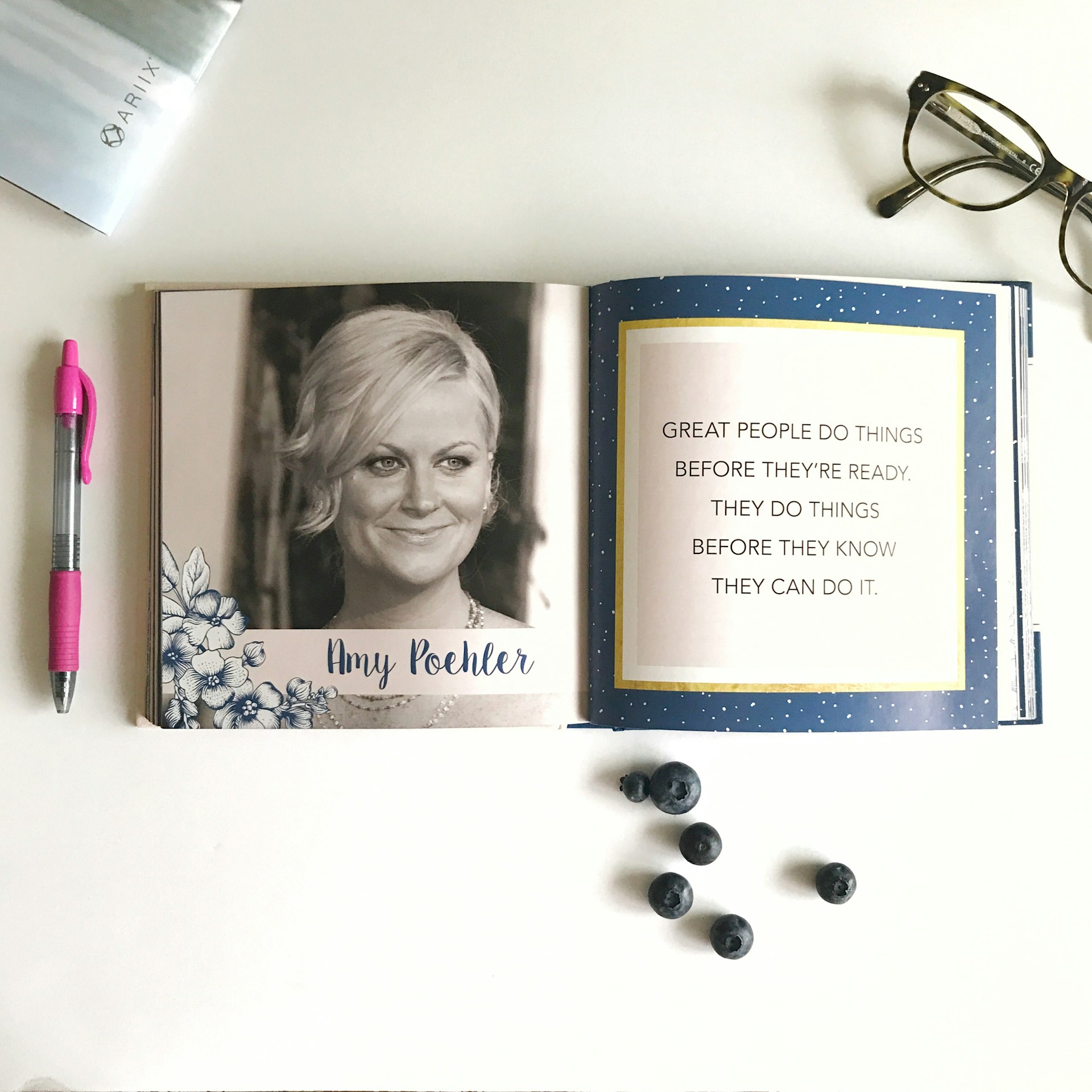 A close-up of an open book authored by Katharina Sophia, showcasing her thoughtful insights and elegant typography.