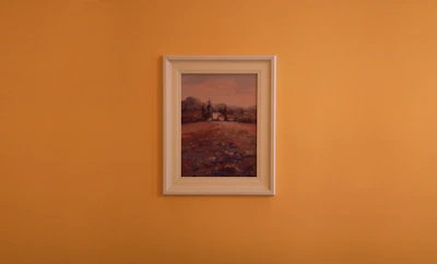 An 8x10 art print featuring a gentle pastel landscape, framed simply on a white wall.