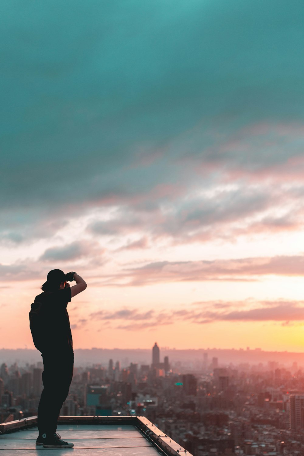 man standing on concrete building