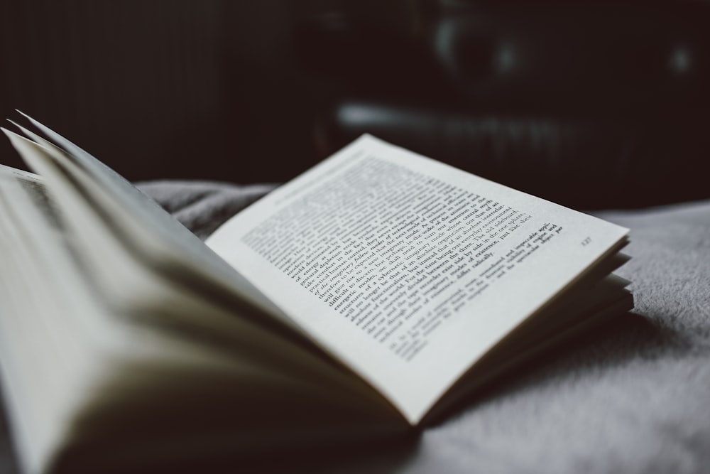 selective focus photography of opened textbook