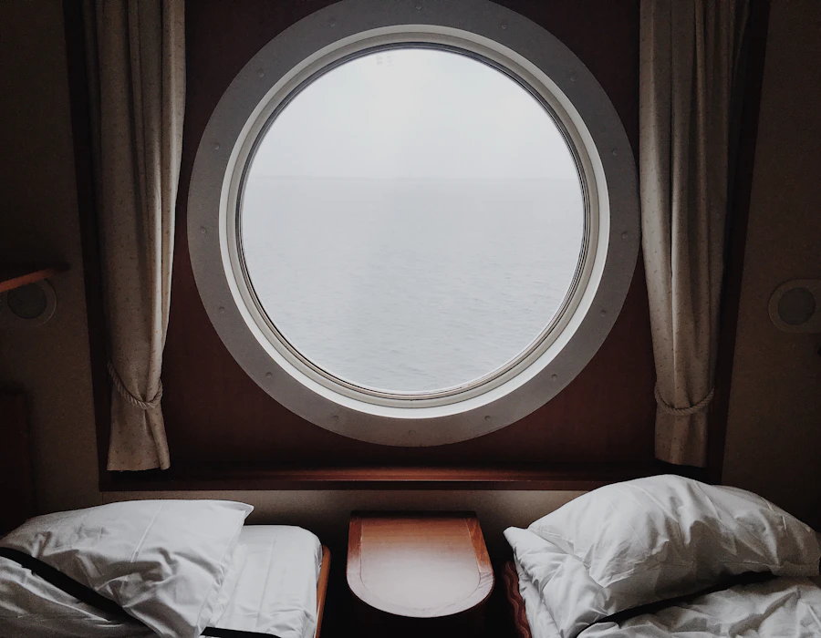 Cabin berth beneath a round porthole