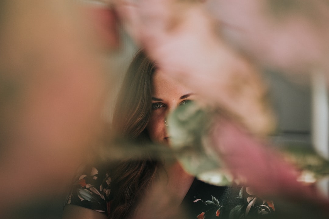 shallow focus photo of woman in black top