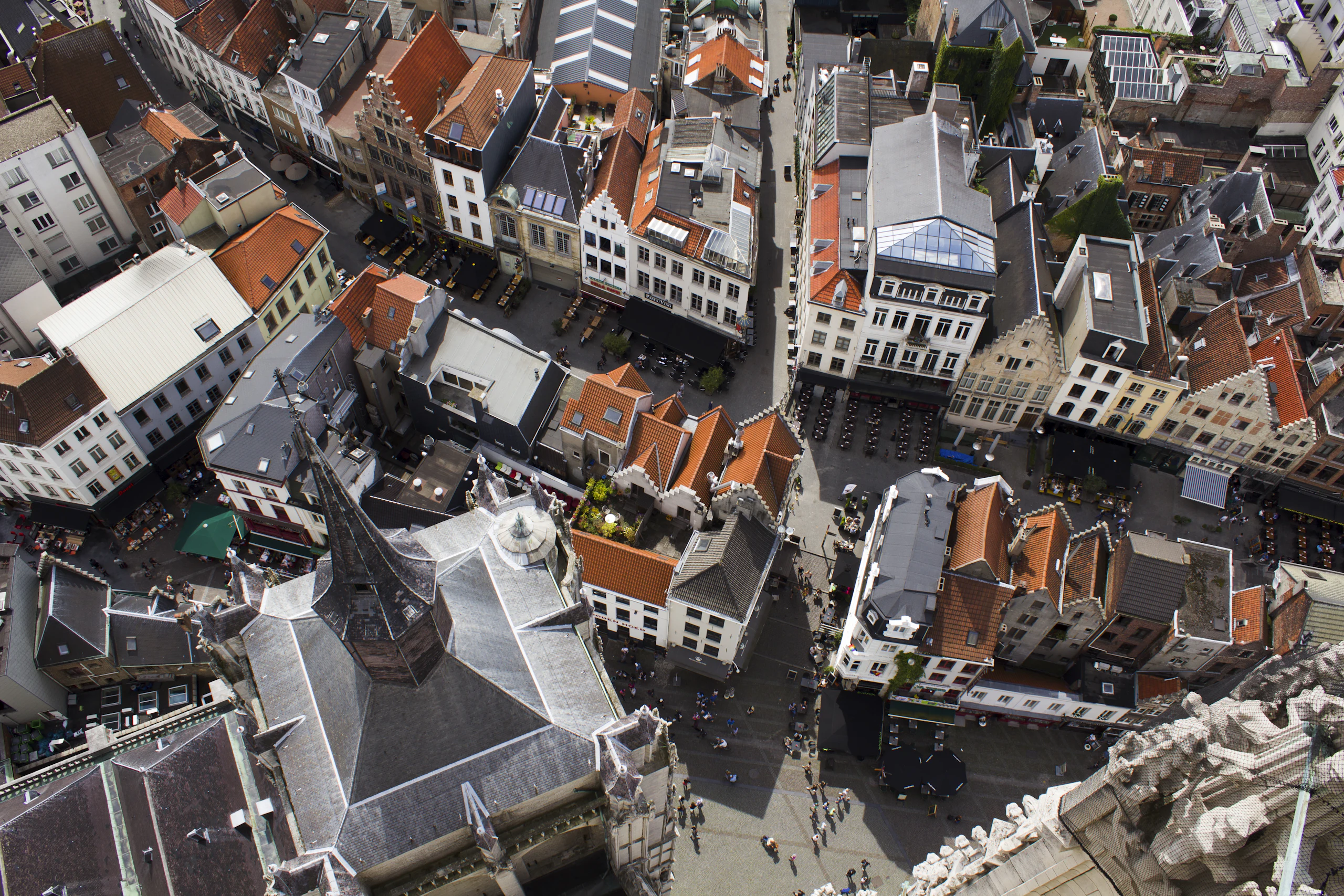 Aerial view of a dense city with rooftops and narrow streets