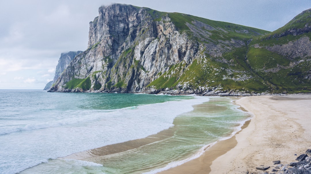 beach near mountain range,