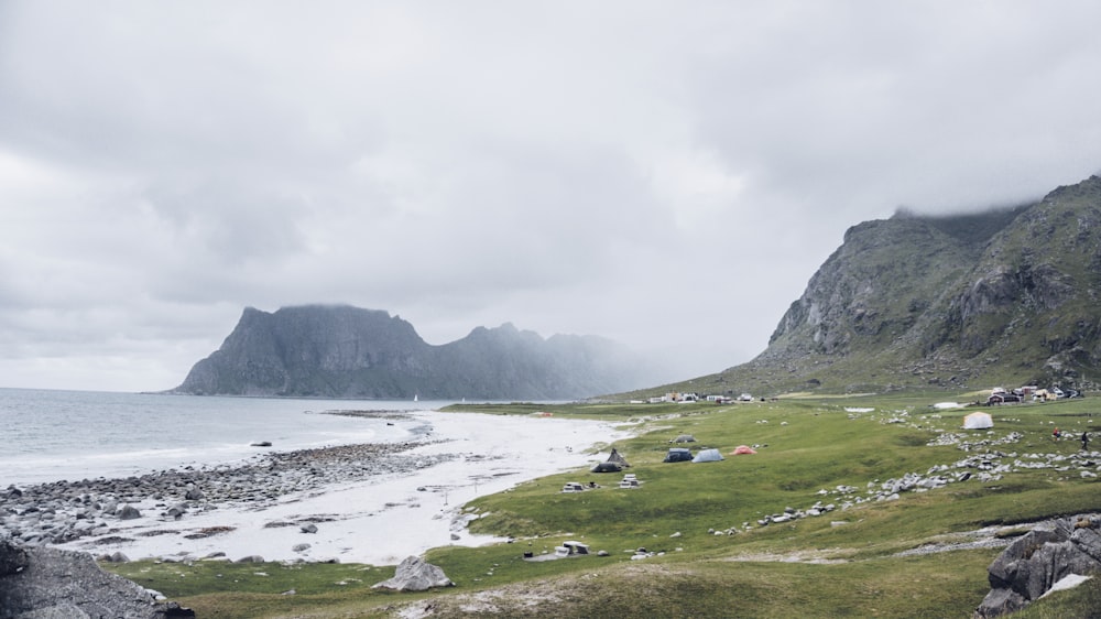 body of water surrounded by mountains