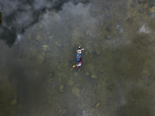 aerial view photo of two person in row boat in Red Deer River Canada