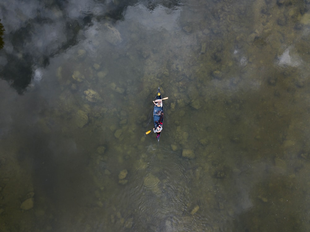 aerial view photo of two person in row boat