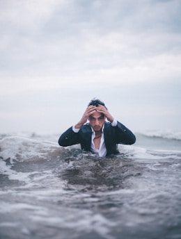 man on body of water during daytime