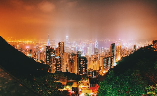 lighted cityscape during nighttime in Victoria Harbour Hong Kong