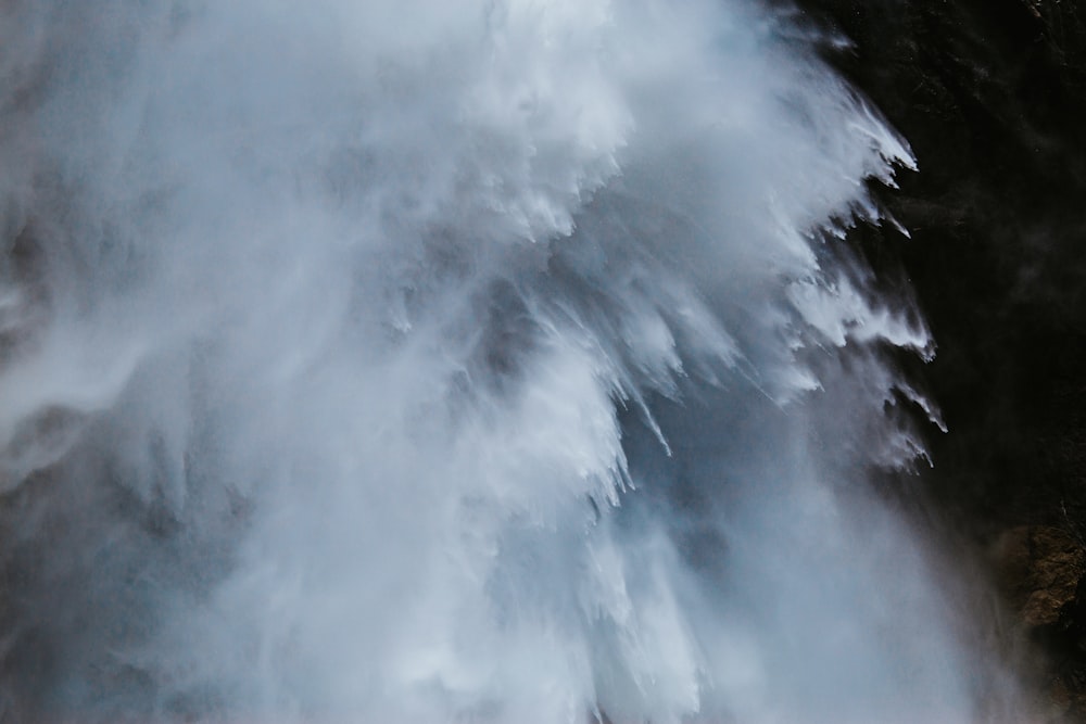 splash of water on brown mountain