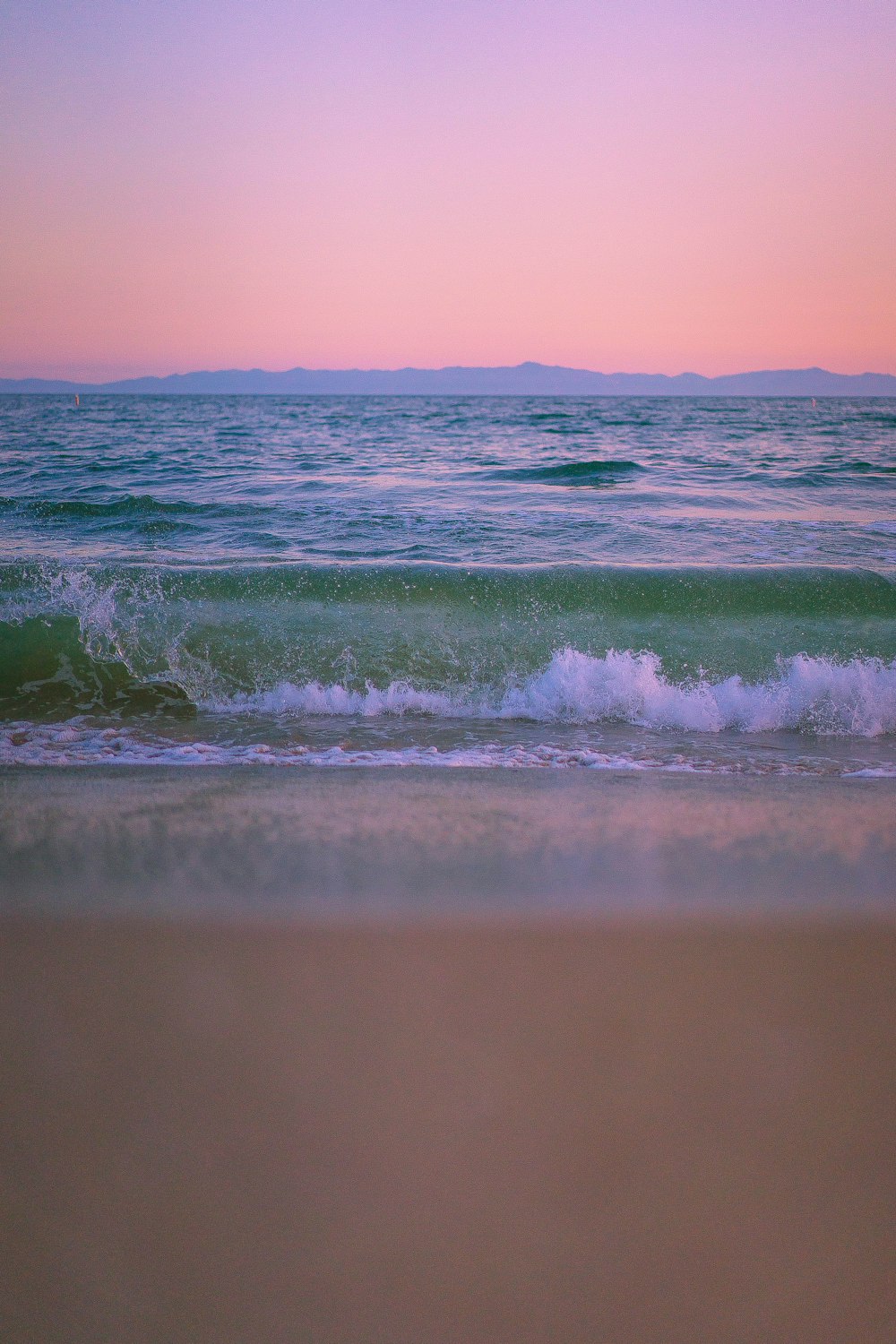 beach wave on white sand