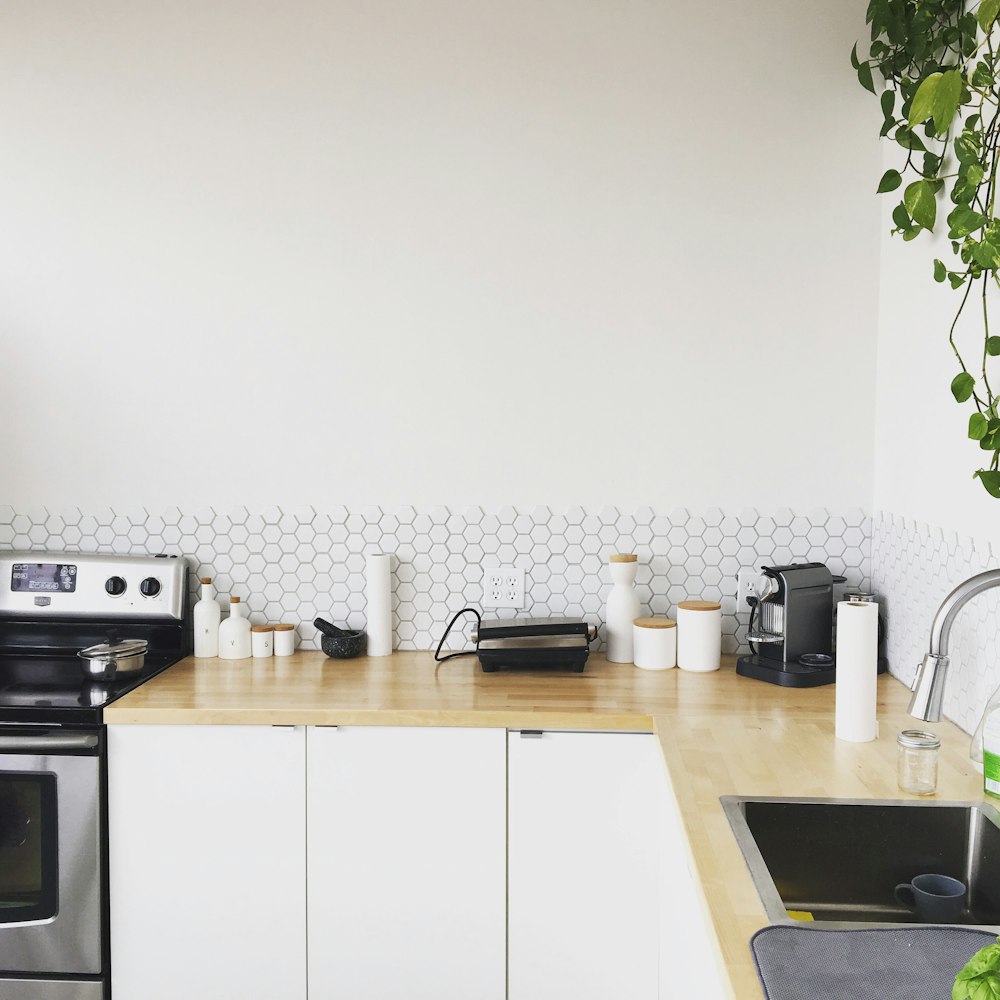 black coffee maker on brown wooden kitchen table