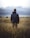 man in middle of wheat field