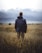 man in middle of wheat field