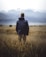 man in middle of wheat field