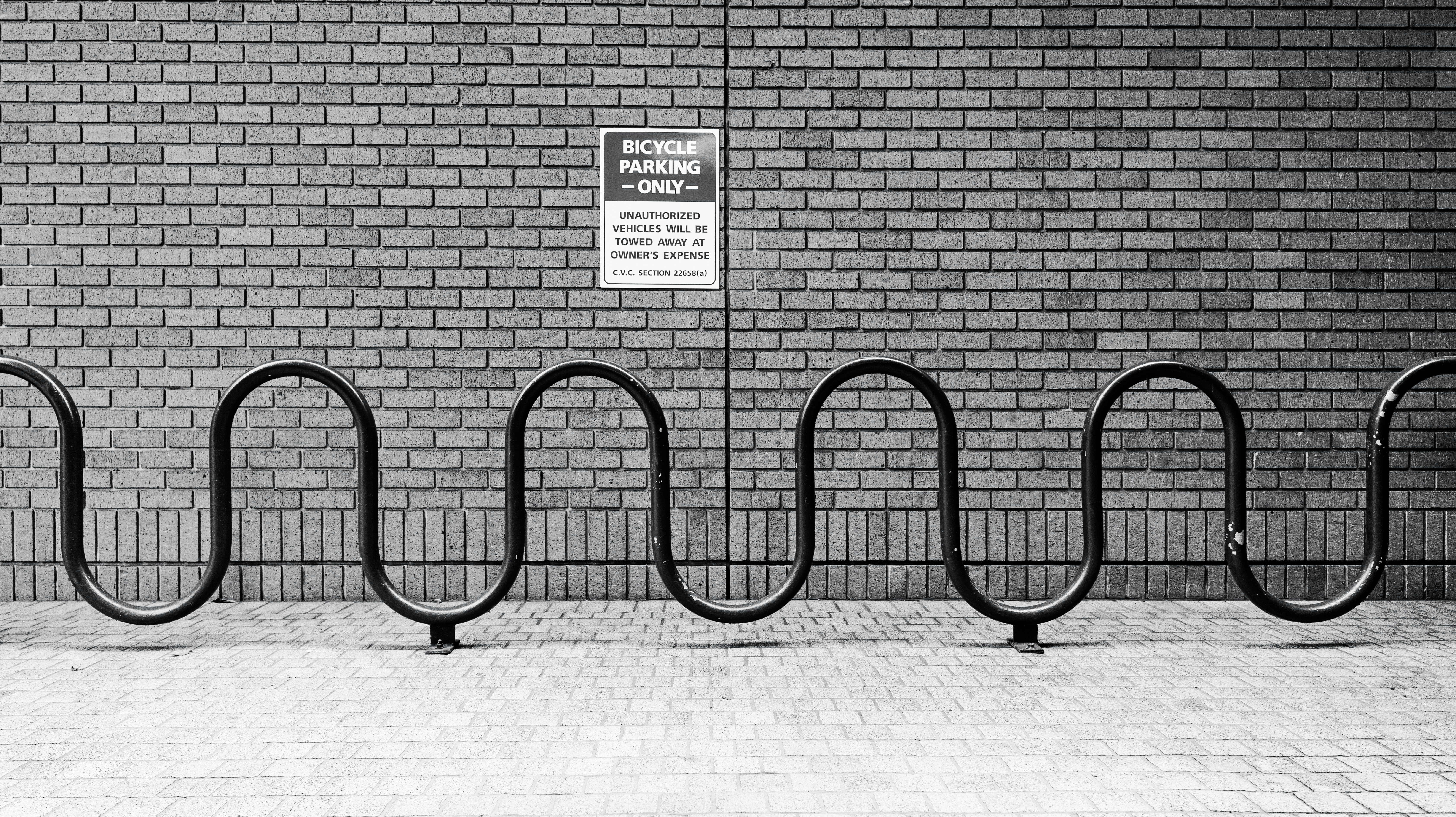 a black and white photo of a bike rack