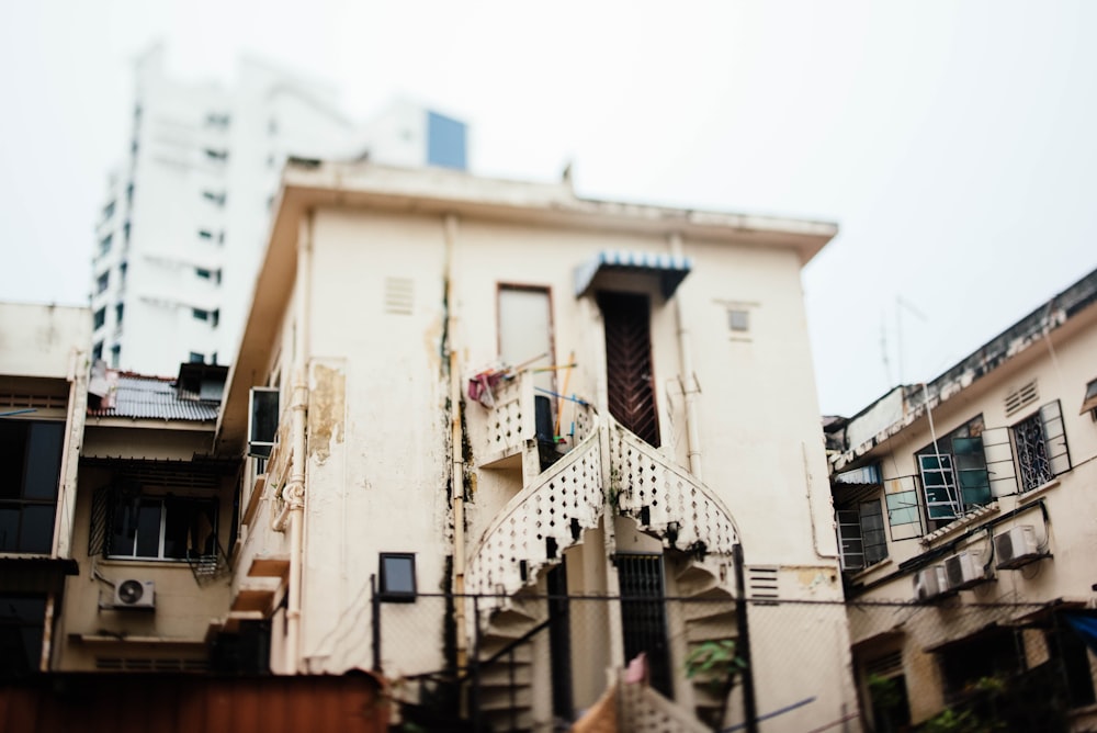 spiral stair beside white structure