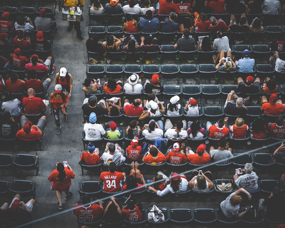 aerial photography of people sitting on gang chair