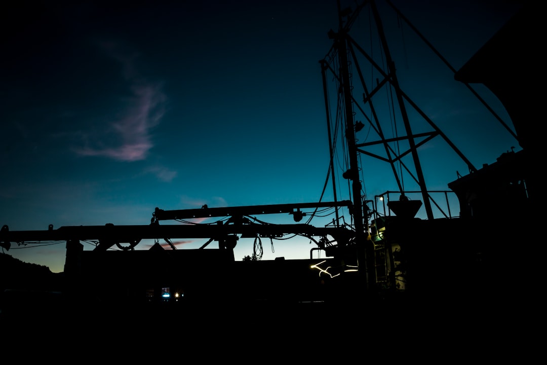 The silhouette of equipment on a boat at dusk in Hoonah