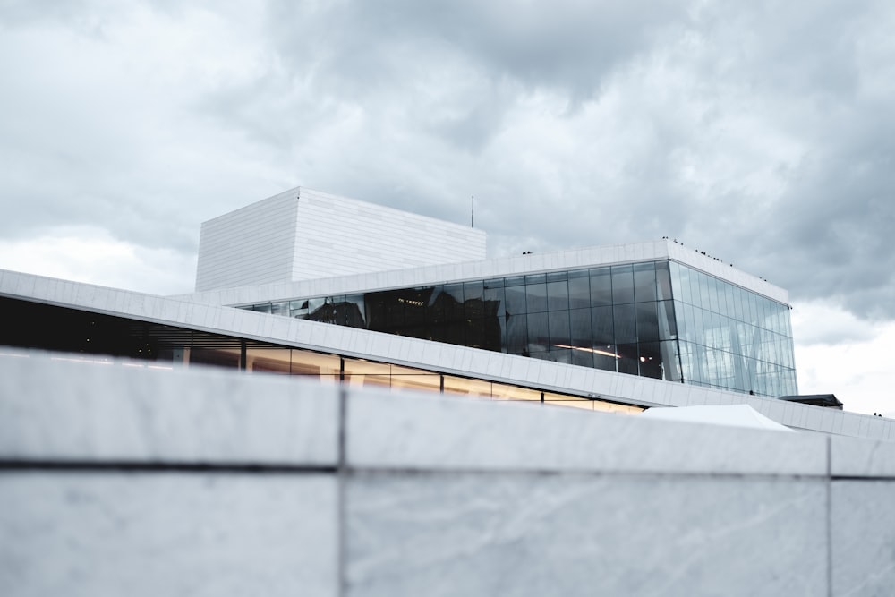 a white building with a large glass window on top of it