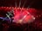 A vibrant concert scene with an enthusiastic crowd enjoying live music.