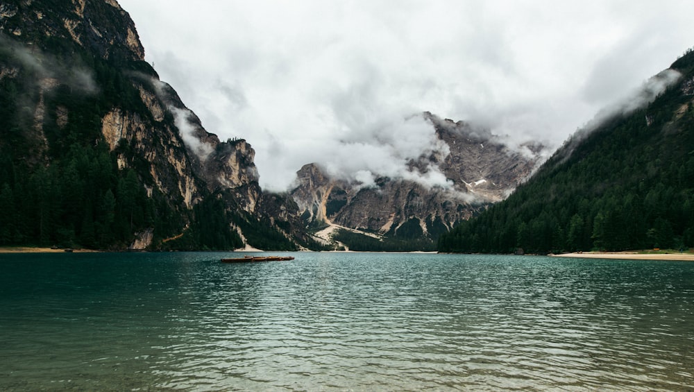 mountain in between body of water