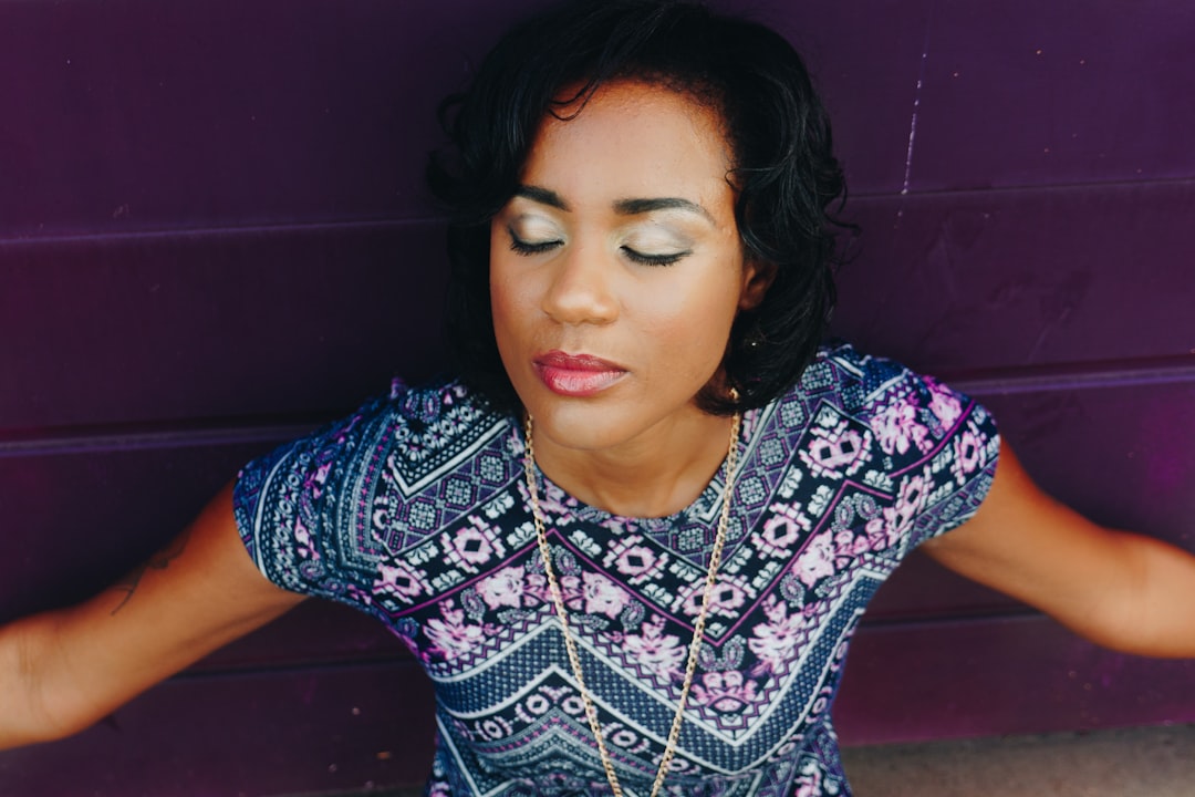 woman wearing pink and blue floral crew-neck shirt