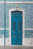blue wooden door closed with 46 sign