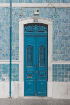 blue wooden door closed with 46 sign