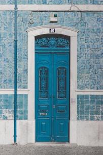 blue wooden door closed with 46 sign